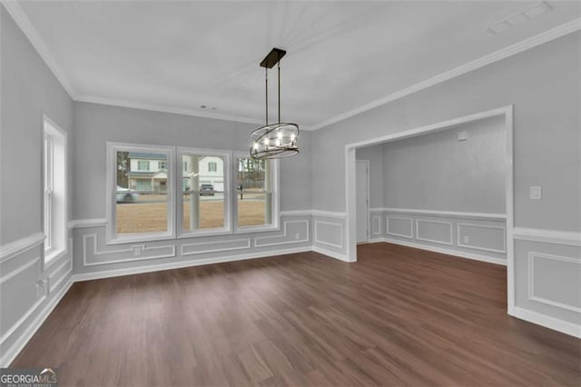250 Stonecreek Pkwy, Covington, GA 30016 - unfurnished dining area with a chandelier, dark wood-type flooring, crown molding, a decorative wall, and wainscoting