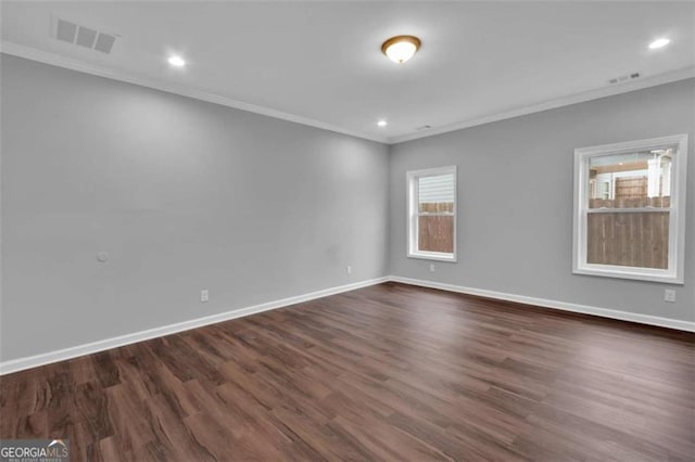 250 Stonecreek Pkwy, Covington, GA 30016 - empty room with crown molding, dark wood-type flooring, and recessed lighting