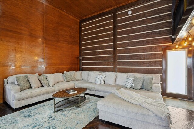 living room featuring dark parquet flooring and wooden walls