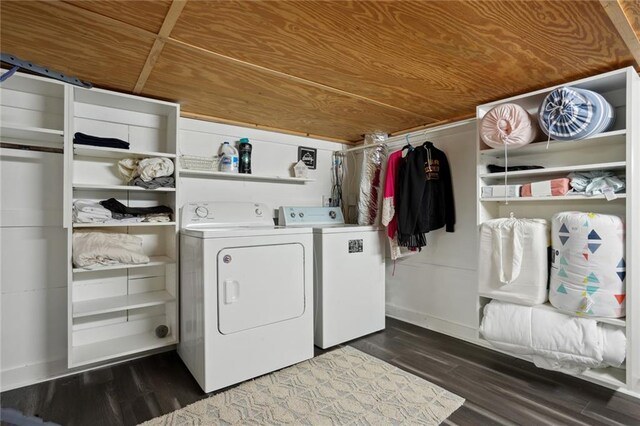 clothes washing area with dark hardwood / wood-style flooring, wood ceiling, and washing machine and clothes dryer