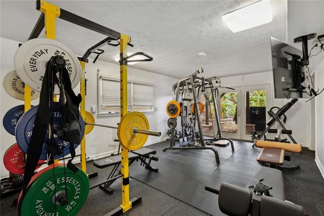 workout area with a textured ceiling