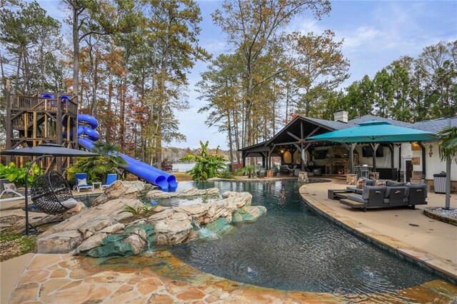 view of swimming pool featuring a patio area