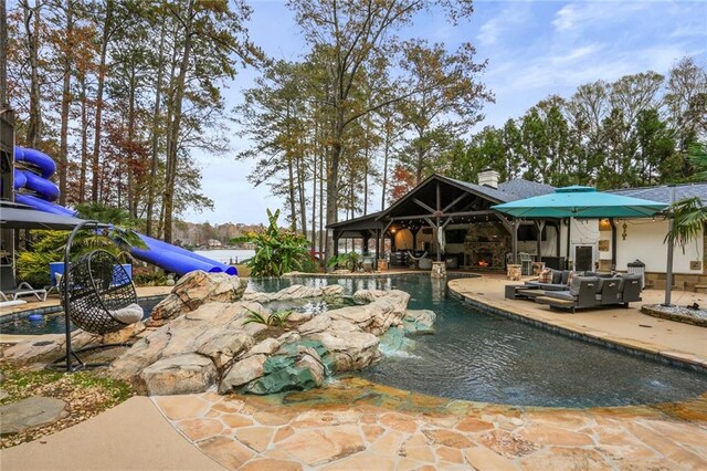 view of swimming pool with a patio area