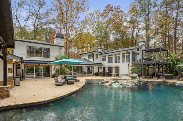 back of property featuring a patio area, an outdoor living space, and cooling unit