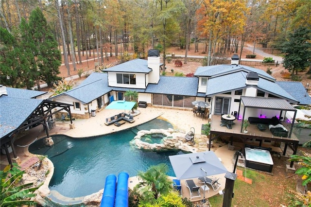 view of swimming pool with a gazebo, a patio area, and an in ground hot tub