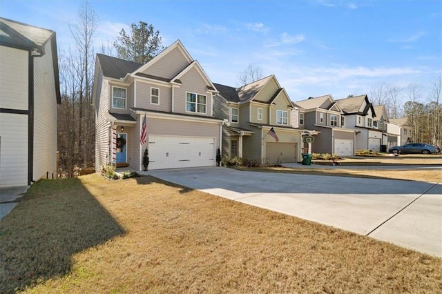 view of front of house featuring a garage and a front lawn