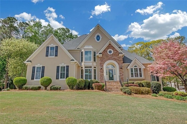 1405 Wilmington Way, Grayson, GA 30017 - view of front of house featuring a front yard and stucco siding