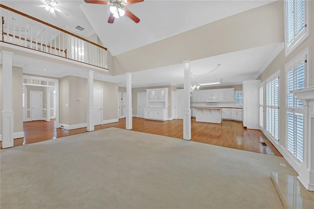 1405 Wilmington Way, Grayson, GA 30017 - unfurnished living room featuring high vaulted ceiling, plenty of natural light, ceiling fan, and light wood-type flooring