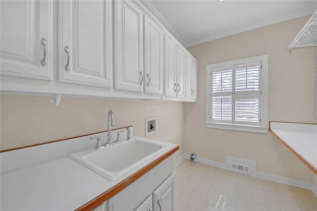 1405 Wilmington Way, Grayson, GA 30017 - laundry room with hookup for a washing machine, cabinet space, baseboards, and crown molding
