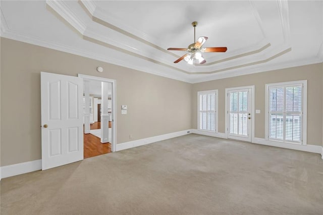 1405 Wilmington Way, Grayson, GA 30017 - carpeted spare room featuring a raised ceiling, crown molding, a ceiling fan, and baseboards