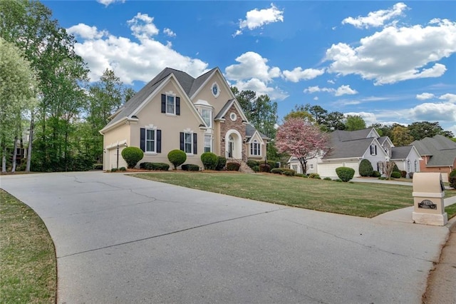 1405 Wilmington Way, Grayson, GA 30017 - traditional home featuring concrete driveway, a front lawn, and stucco siding