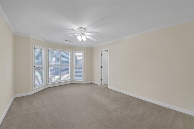 1405 Wilmington Way, Grayson, GA 30017 - unfurnished room featuring crown molding, carpet flooring, ceiling fan, and baseboards