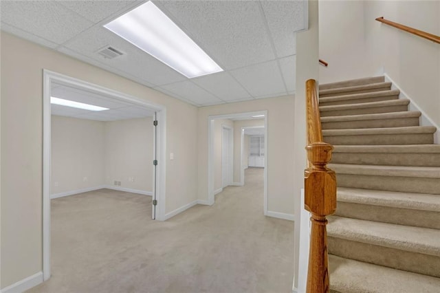 1405 Wilmington Way, Grayson, GA 30017 - stairway featuring a drop ceiling, carpet, and baseboards