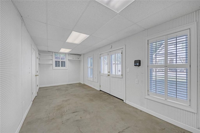 1405 Wilmington Way, Grayson, GA 30017 - foyer entrance featuring concrete flooring, baseboards, and a drop ceiling