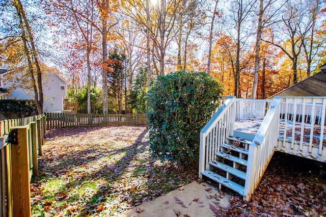 view of yard with a wooden deck