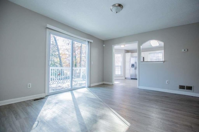 interior space with hardwood / wood-style floors and a textured ceiling