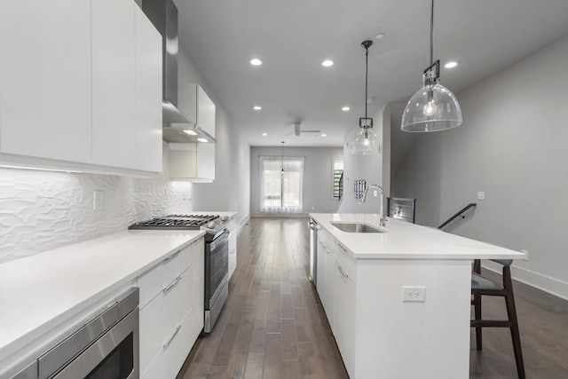 133 City View Ct NE, Atlanta, GA 30308 - kitchen featuring stainless steel appliances, modern cabinets, wall chimney range hood, and recessed lighting