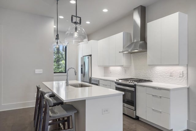 133 City View Ct NE, Atlanta, GA 30308 - kitchen with stainless steel appliances, wall chimney range hood, an island with sink, modern cabinets, and decorative backsplash