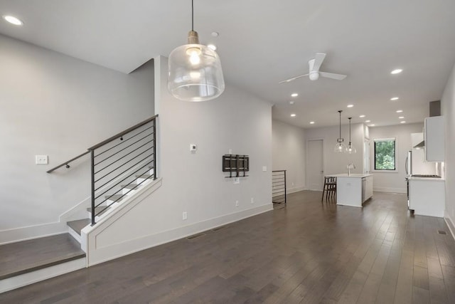 133 City View Ct NE, Atlanta, GA 30308 - unfurnished living room featuring dark wood-style flooring, ceiling fan, recessed lighting, and stairway
