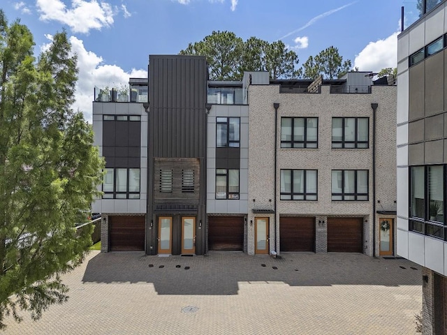 133 City View Ct NE, Atlanta, GA 30308 - view of front of home featuring board and batten siding and a garage