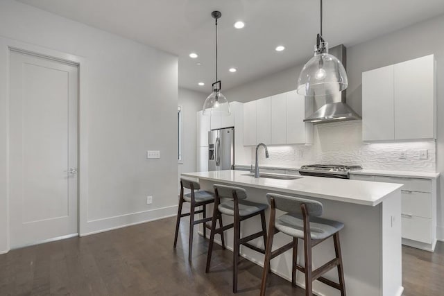 133 City View Ct NE, Atlanta, GA 30308 - kitchen featuring appliances with stainless steel finishes, a breakfast bar, an island with sink, decorative backsplash, and recessed lighting