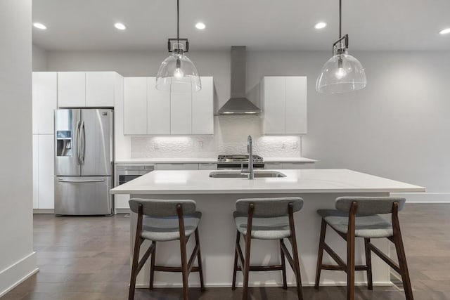 133 City View Ct NE, Atlanta, GA 30308 - kitchen featuring stainless steel fridge, wall chimney exhaust hood, light countertops, a breakfast bar area, and decorative backsplash