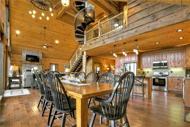 dining room with ceiling fan, beamed ceiling, high vaulted ceiling, and dark wood-type flooring