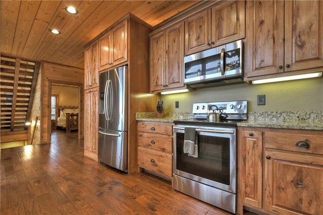 kitchen featuring light stone countertops, dark hardwood / wood-style flooring, wooden ceiling, and appliances with stainless steel finishes