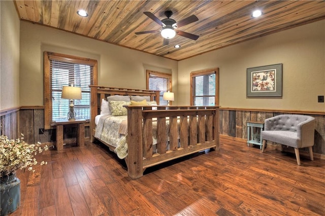 bedroom featuring hardwood / wood-style flooring, ceiling fan, and wooden ceiling