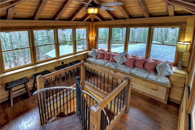 interior space featuring vaulted ceiling with beams, ceiling fan, wooden ceiling, and dark wood-type flooring