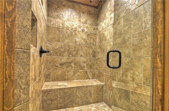 bathroom featuring a shower with door