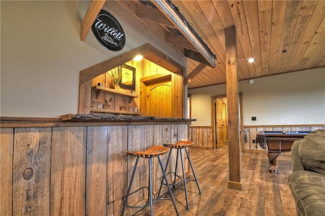 bar featuring hardwood / wood-style flooring, wood walls, wooden ceiling, and billiards