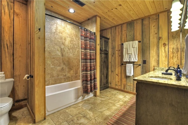 full bathroom featuring shower / bath combination with curtain, vanity, toilet, and wooden walls