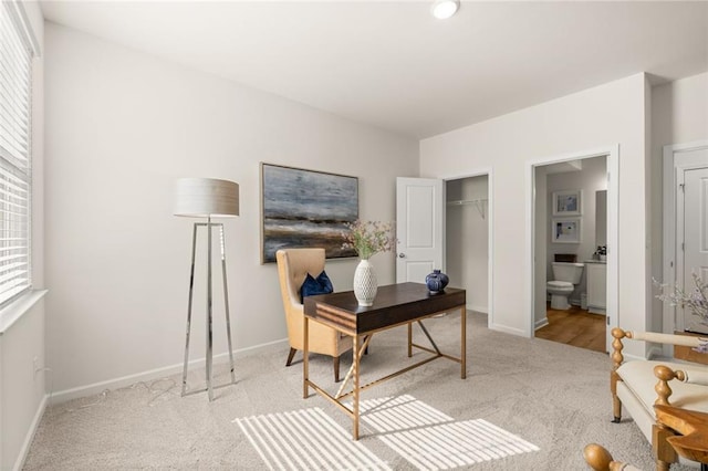 carpeted office space with baseboards