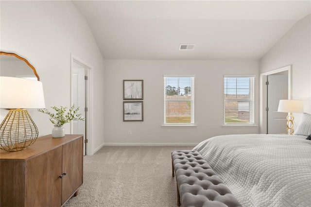bedroom featuring baseboards, visible vents, light colored carpet, and lofted ceiling