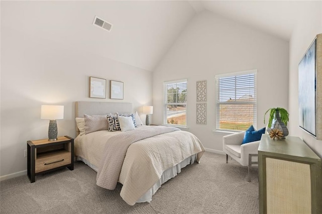 bedroom with baseboards, visible vents, light carpet, and high vaulted ceiling
