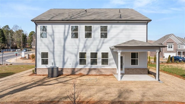 back of property featuring central AC and a patio