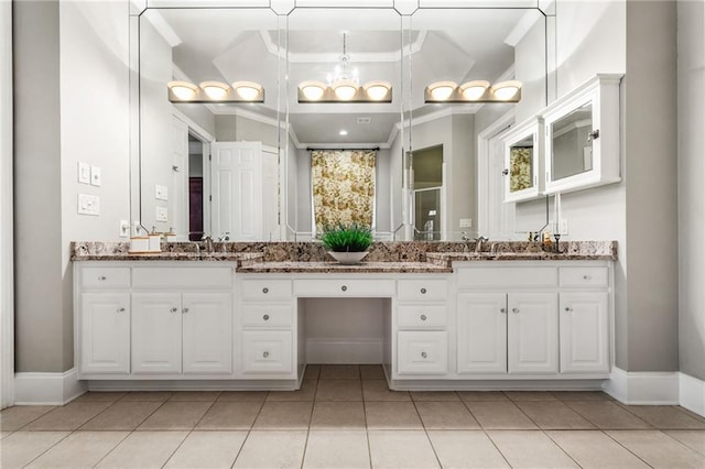 bathroom featuring tile patterned flooring, vanity, and ornamental molding