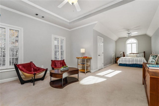 carpeted bedroom featuring vaulted ceiling, ceiling fan, and crown molding