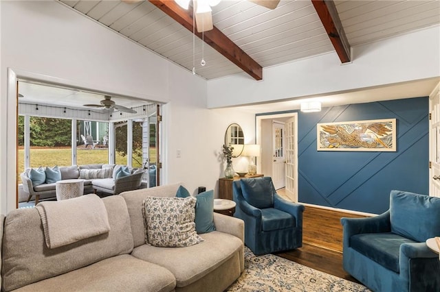 living room with wood finished floors, vaulted ceiling with beams, ceiling fan, and wooden ceiling