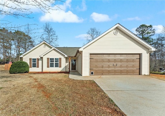 ranch-style house with a garage and a front yard