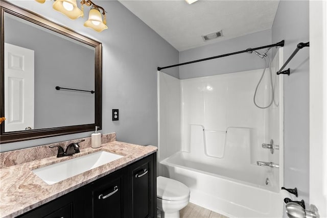 full bathroom featuring vanity, toilet, and shower / bath combination