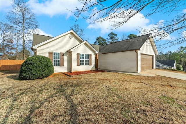 exterior space with a garage and a front lawn