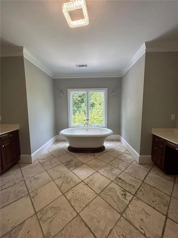 bathroom featuring crown molding, a tub, and vanity