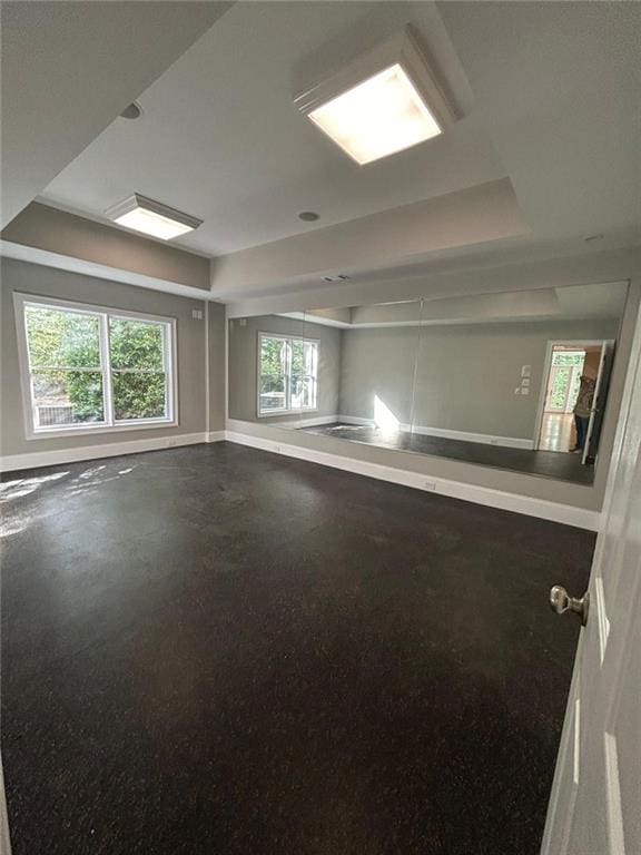 spare room featuring a raised ceiling