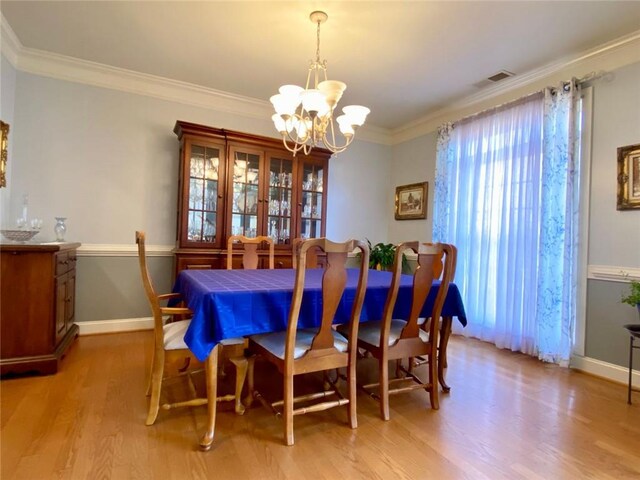 living room featuring a wealth of natural light, light wood-type flooring, and french doors