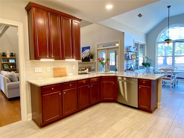 kitchen featuring crown molding, backsplash, stainless steel appliances, independent washer and dryer, and light stone counters