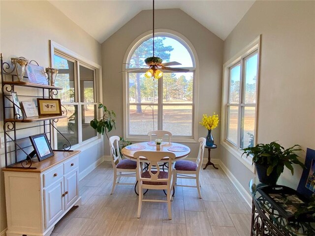 bedroom featuring a tray ceiling, ornamental molding, light colored carpet, and ceiling fan