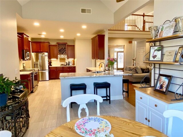 bedroom with crown molding, ceiling fan, and a tray ceiling