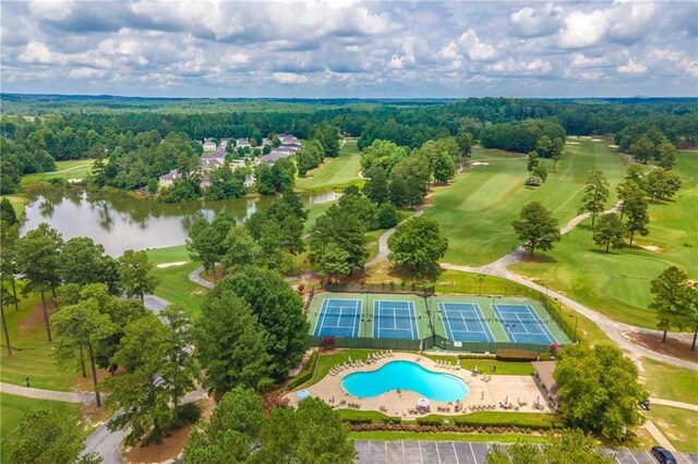 view of swimming pool with a yard and a patio